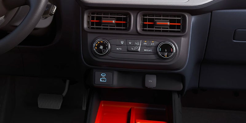Close-up of Ford truck climate controls and USB ports.