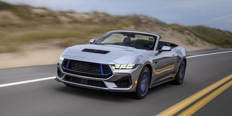 Ford Mustang driving on road